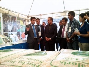 Minister Sabino speaking with the President and MAF-SoL staff at the Seeds of Life stand