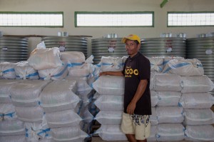 Staff member at Corluli seed warehouse in Maliana.