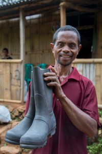 This farmer from Ermera is happy to receive a pair of quality Hunter boots