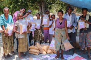 Members from Buirudu commercial seed producer in Hato Udo, Ainaro district, show off some of the 1.8 tonnes of Sele seed they produced in 2013-14 © Ivan Lopes/Seeds of Life